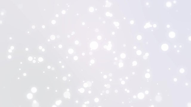 Sparkly light particles falling down a silver white gradient background