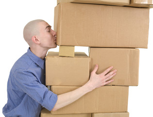Man kisses heap cardboard boxes