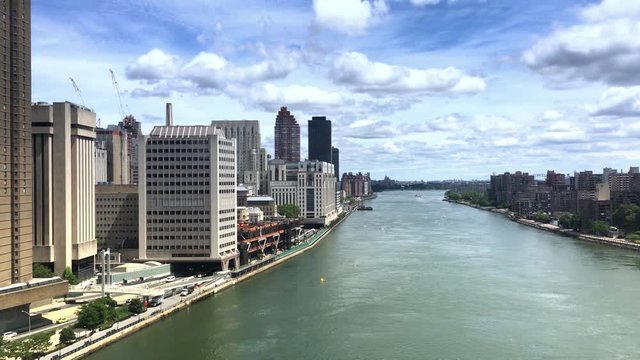 NEW YORK - Circa July, 2016 - A unique aerial view of the East River as seen from the Roosevelt Island Tramway. Part 1 of 2.  	