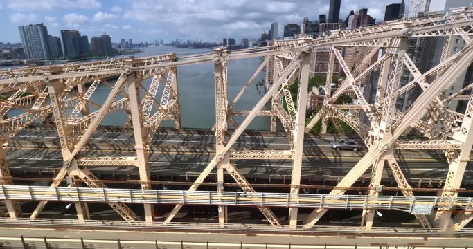 NEW YORK - Circa July, 2016 - A unique aerial side view of traffic on the Ed Koch Queensboro Bridge as seen from the Roosevelt Tramway.  	