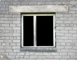 Dark window of the thrown old building