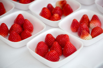 fresh juicy strawberry in a white bowl