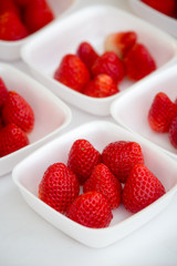 fresh juicy strawberry in a white bowl