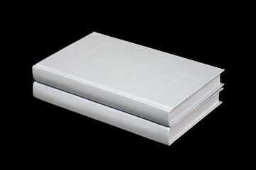 Two books on a black background