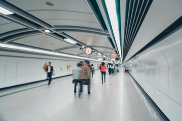 business people walk at subway station
