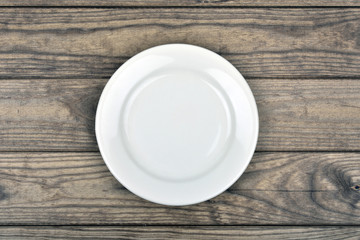 Empty plate on wooden table