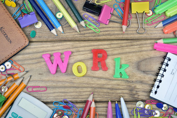 Work word and office tools on wooden table