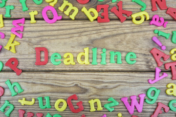 Deadline on wooden table