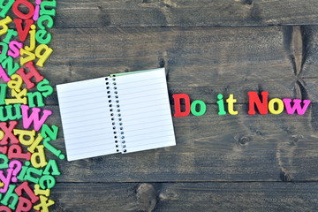 Fototapeta premium Do it now on wooden table