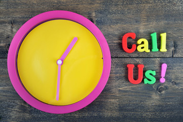 Call Us on wooden table