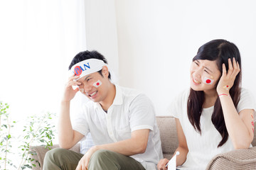 Obraz premium スポーツのテレビ観戦、女性、男性、2ショット、失点、ショック