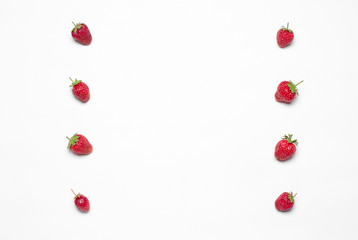 Healthy eating in the restaurant and diet Topic: Beautiful ripe strawberry lie in a frame on a white table in the studio isolated top view