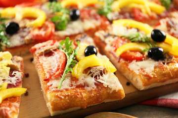 Pieces of delicious pizza on the table, close-up