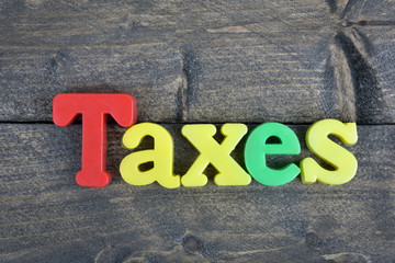 Fototapeta premium Taxes on wooden table