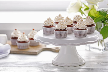 Tasty cupcakes on stand