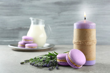Obraz na płótnie Canvas Delicious macaroons, milk and lavender on table