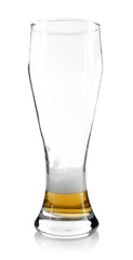 Almost empty beer glass, isolated on white
