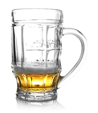 Almost empty beer glass, isolated on white