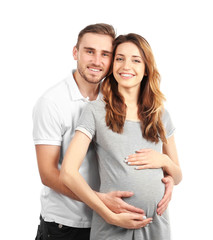 Happy family expecting baby isolated on white