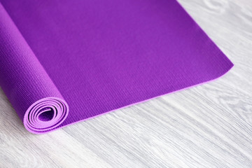 Mat for fitness on wooden floor