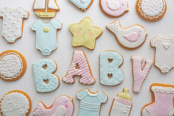 Baby shower cookies on table - obrazy, fototapety, plakaty