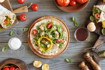 Open tortilla with grilled chicken fillet