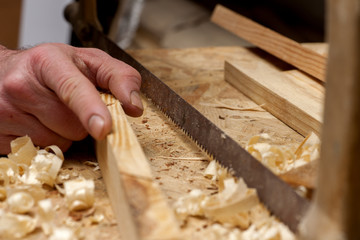 carpenter working,hammer,meter and screw-driver on construction background