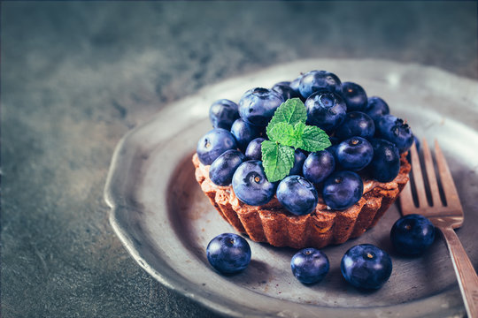 Blueberry mini tarts on plate