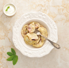 Vareniki with cherries and sour cream