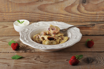 Vareniki with cherries and sour cream