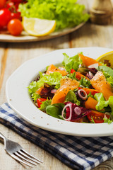 Fresh salad with smoked salmon.