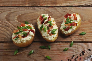 stuffed baked potatoes in jacket with bacon and cheese