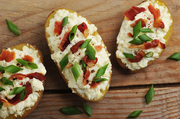 stuffed baked potatoes in jacket with bacon and cheese