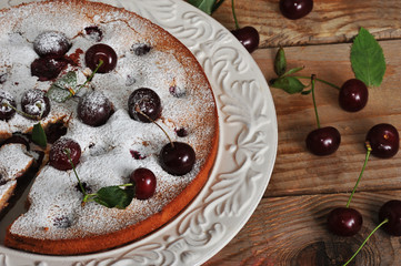 Homemade cherry pie on rustic background