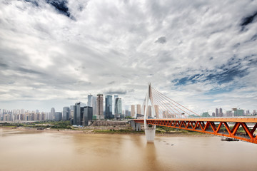 Naklejka premium cityscape and skyline downtown near bridge of chongqing in cloud