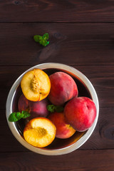 Fresh peaches on wooden background, top view, flat lay