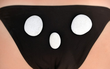 Photo girls in bikini and stone