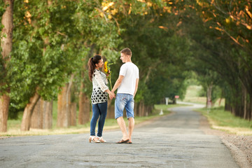 Obraz premium happy young couple walk on country road outdoor, romantic people concept, summer season