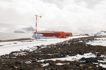 Building on the coastal area and glacier background at Antarctica