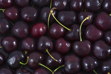Many red cherries as background