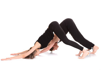 Fototapeta na wymiar Man and woman doing yoga