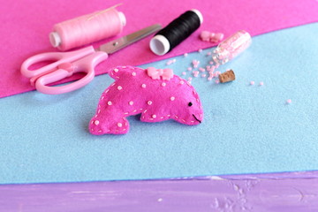 Cute pink felt Dolphin embellished with beads and button. Stuffed sea animal toy. Creative felt marine creature crafts for kids. Sewing materials and supplies
