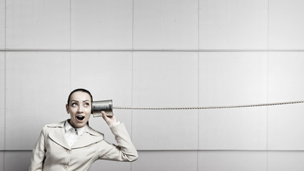 Woman using deaf phone . Mixed media