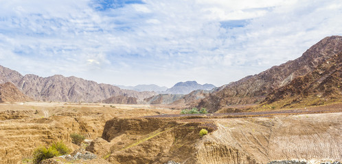 Desert landscape with mountains in the background in the United Arab Emirates