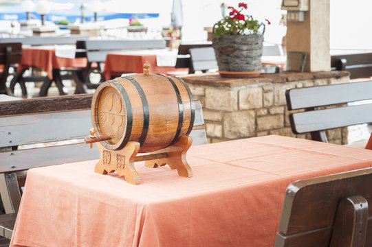 Small barrel of wine on table of restaurant
