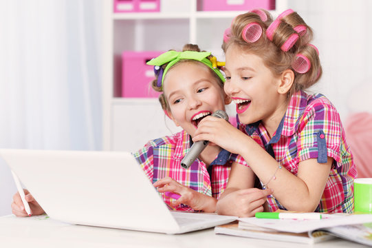 Cute  tweenie girls  with laptop