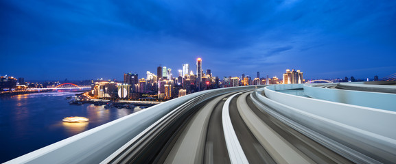 busy traffic on highway with cityscape and skyline of chongqing