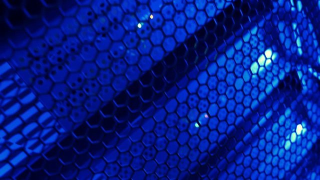 Flashing lights in row of the network servers in a data center in blue light. Shot in motion
