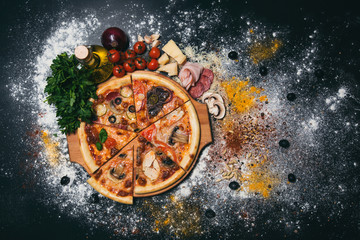 Obraz na płótnie Canvas Tasty pizza on black background