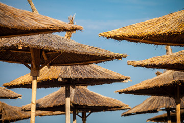Fototapeta premium Color picture of straw beach umbrella